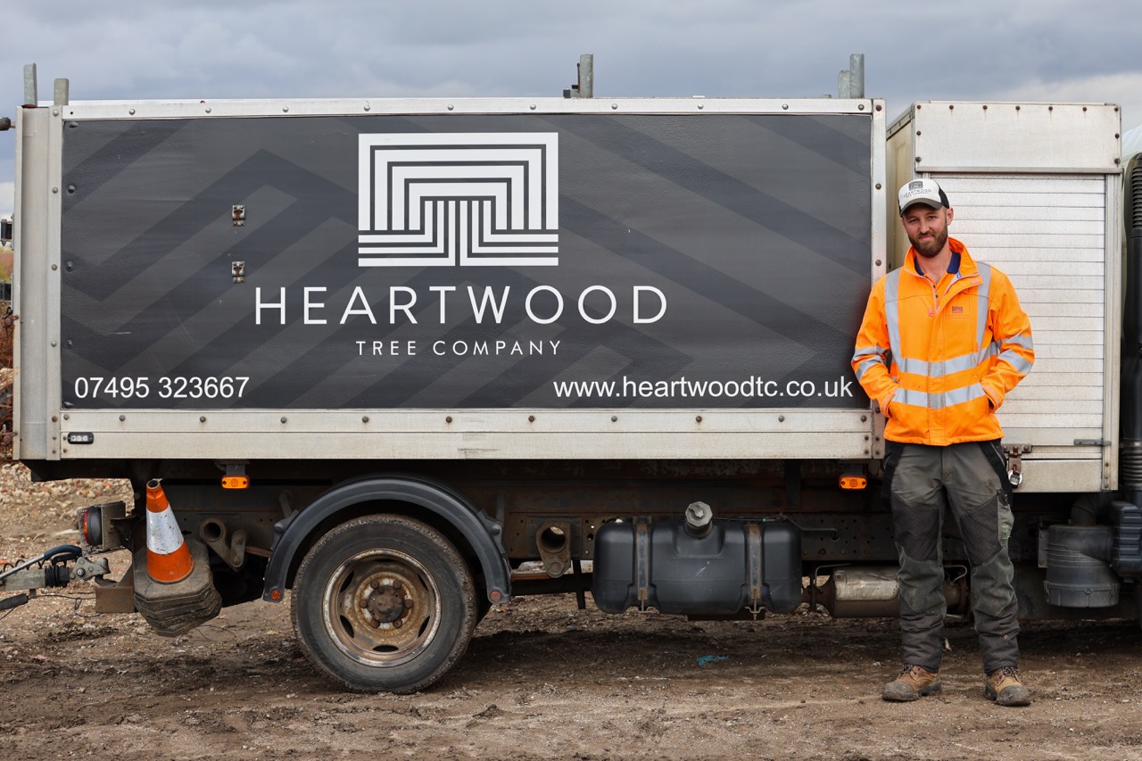 Jack Hale standing next to his Heartwood Tree Company truck