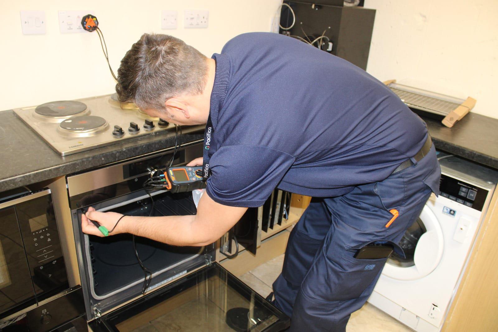 ASAP Repairs technician diagnosing oven issues with professional testing equipment